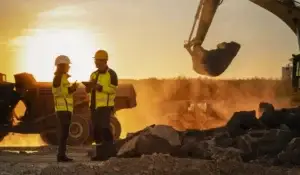 Two workers in a construction site.