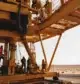 Workers on an oil rig in the desert.