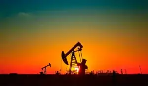 Silhouetted oil pump jacks at sunset, highlighting the importance of royalty rights in Texas